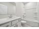 Bright bathroom featuring single sink vanity, toilet, and combined shower/tub at 9924 Manor Vista Trl, Kannapolis, NC 28027