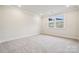 Clean and well-lit bedroom featuring plush carpet flooring and natural light at 9924 Manor Vista Trl, Kannapolis, NC 28027