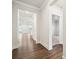 Inviting hallway with dark wood floors leading to open living spaces at 9924 Manor Vista Trl, Kannapolis, NC 28027