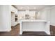 Spacious kitchen with white cabinets, stainless steel appliances, and large center island at 9924 Manor Vista Trl, Kannapolis, NC 28027