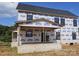 New construction of a two-story home with a covered porch, framed windows and brick foundation at Lot 100 Coppergate Dr, Salisbury, NC 28147