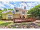 Large backyard features a wooden deck with an awning, perfect for outdoor entertaining and relaxation at 1066 Iveywood Nw Pl, Concord, NC 28027
