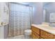 Cozy bathroom with a vanity, toilet, and a shower with a patterned curtain at 1066 Iveywood Nw Pl, Concord, NC 28027