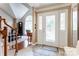 Open foyer with a tiled floor, decorative front door, and view of the living room at 1066 Iveywood Nw Pl, Concord, NC 28027