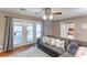 Inviting living room with access to the deck and a view of the backyard at 1066 Iveywood Nw Pl, Concord, NC 28027