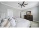 Cozy bedroom with a large bed, dresser, and a view into the next room, creating a relaxing atmosphere at 11216 Preservation Ln, Charlotte, NC 28278