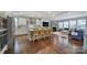 Open-concept kitchen features a large island with seating, granite countertops, and stainless steel appliances at 11216 Preservation Ln, Charlotte, NC 28278