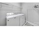 Efficient laundry room with modern washer and dryer units, providing convenience and functionality at 11216 Preservation Ln, Charlotte, NC 28278