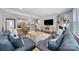 Open-concept living room features a fireplace, hardwood floors, and an eat-in kitchen at 11216 Preservation Ln, Charlotte, NC 28278
