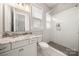 Elegant bathroom features a glass shower, vanity with marble countertop, and ample natural light at 1152 Grand Oak Dr, Waxhaw, NC 28173