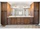 Bathroom vanity area showcases dual sinks, plentiful storage, and attractive fixtures beneath modern lighting at 1152 Grand Oak Dr, Waxhaw, NC 28173