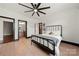 Comfortable bedroom features neutral tones, a cozy bed, and en-suite bathroom for added convenience at 1152 Grand Oak Dr, Waxhaw, NC 28173