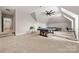Large bonus room featuring games, carpeted flooring, and stylish ceiling fan at 1152 Grand Oak Dr, Waxhaw, NC 28173