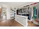 Walk-in closet with custom shelving and dresser, offering an organized storage solution and stylish design at 1152 Grand Oak Dr, Waxhaw, NC 28173