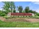 Community entrance sign showcasing lush landscaping and a welcoming entrance to the neighborhood at 1152 Grand Oak Dr, Waxhaw, NC 28173