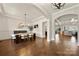 Elegant dining room featuring hardwood floors, wainscoting, and open access to other living spaces at 1152 Grand Oak Dr, Waxhaw, NC 28173