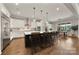 Spacious kitchen featuring an island with barstool seating and modern appliances at 1152 Grand Oak Dr, Waxhaw, NC 28173
