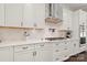 Bright and modern kitchen with white cabinets, quartz countertops, and stainless steel appliances at 1152 Grand Oak Dr, Waxhaw, NC 28173