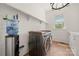 Convenient laundry room with modern appliances, storage shelves, and stylish design at 1152 Grand Oak Dr, Waxhaw, NC 28173