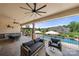 Beautiful outdoor patio with a seating area, outdoor kitchen and a view of the sparkling pool at 1152 Grand Oak Dr, Waxhaw, NC 28173