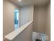 Upstairs hallway with natural light and neutral paint, ready for your personal touch at 116 Crownpiece St, Troutman, NC 28166