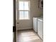 Functional laundry room with modern washer and dryer hookups at 116 Crownpiece St, Troutman, NC 28166