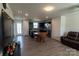 Open living space with modern kitchen, wood floors and comfortable seating arrangement at 116 Crownpiece St, Troutman, NC 28166