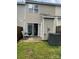 Exterior shot of backyard featuring a table and chairs on a patio at 12238 Paperbark Cir, Charlotte, NC 28277