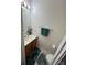 A powder room featuring tile flooring and a stylish vanity at 12238 Paperbark Cir, Charlotte, NC 28277