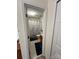 Connected bathroom boasts a wooden vanity and floral shower curtain at 12238 Paperbark Cir, Charlotte, NC 28277