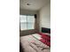 Cozy bedroom with a window providing natural light at 12238 Paperbark Cir, Charlotte, NC 28277