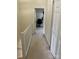 Hallway view showcasing carpet, closet, and office space at 12238 Paperbark Cir, Charlotte, NC 28277