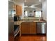 Well-lit kitchen features stainless steel appliances, granite countertops, and opens to the living area at 12238 Paperbark Cir, Charlotte, NC 28277