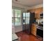 Kitchen with stainless steel appliances, granite countertops, and a window with a view of the outdoors at 12238 Paperbark Cir, Charlotte, NC 28277