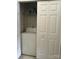 Laundry closet features a washer, shelving, and sliding doors for easy access at 12238 Paperbark Cir, Charlotte, NC 28277
