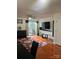 Bright living area features hardwood floors, ceiling fan, and sliding door to the outside at 12238 Paperbark Cir, Charlotte, NC 28277