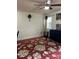 Living area with hardwood floors, ceiling fan, window, and a black console table at 12238 Paperbark Cir, Charlotte, NC 28277