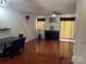 Spacious living room features wood floors, lots of sunlight, and neutral paint for easy customization at 12238 Paperbark Cir, Charlotte, NC 28277