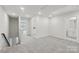 Spacious, carpeted bedroom with a neutral color scheme, natural light, and adjacent bathroom at 124 Utility Ln # B, Mooresville, NC 28117