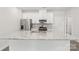 Well-lit kitchen boasts stainless steel appliances, granite countertops, and a functional island at 124 Utility Ln # B, Mooresville, NC 28117
