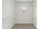 Spacious walk-in closet featuring carpeted floors, and white shelving at 124 Utility Ln # B, Mooresville, NC 28117