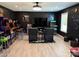 Finished game room with recessed lights, dark walls, vinyl floors, and room for games at 12517 Pine Terrace Ct, Charlotte, NC 28273