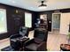 Finished basement game room with arcade games, gaming chairs, and chalkboard accent wall at 12517 Pine Terrace Ct, Charlotte, NC 28273