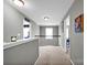 Upstairs hallway with neutral paint, carpet and offers views into adjacent bedrooms at 12517 Pine Terrace Ct, Charlotte, NC 28273