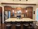 Spacious kitchen featuring a large island, stainless steel appliances, and custom cabinetry at 12517 Pine Terrace Ct, Charlotte, NC 28273