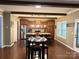 Open kitchen layout with a breakfast bar, stainless steel appliances, and hardwood floors at 12517 Pine Terrace Ct, Charlotte, NC 28273