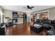 Spacious living room features hardwood floors, ceiling fan, and open layout to the kitchen at 12517 Pine Terrace Ct, Charlotte, NC 28273