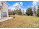 Large backyard features mature trees, lush lawn, and space for recreation and outdoor enjoyment at 130 Valley Glen Dr, Troutman, NC 28166