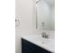 Clean bathroom featuring a modern faucet, a bright white countertop and a sleek vanity mirror at 130 Valley Glen Dr, Troutman, NC 28166
