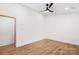 Comfortable bedroom featuring light hardwood floors, fresh paint, and doorways at 130 Valley Glen Dr, Troutman, NC 28166